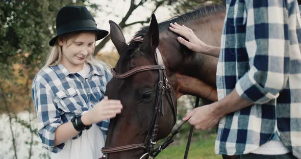 Girl Strokes a Horse  Walk on the Ranch