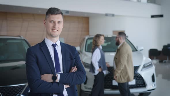 Portrait of a Sales Manager for New Cars in the Salon of an Official Dealer