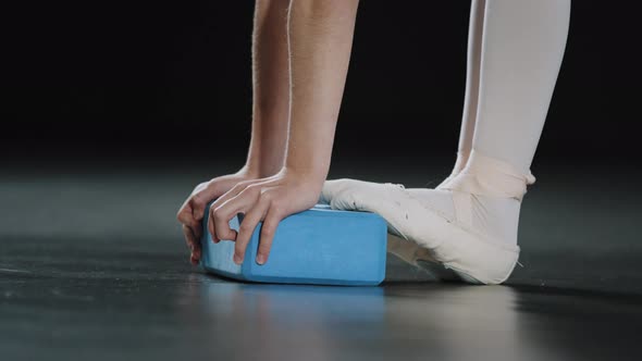 Unrecognizable Girl Ballerina Gymnast Dancer Teenager Bending Standing Feet in Pointe Shoes Ballet