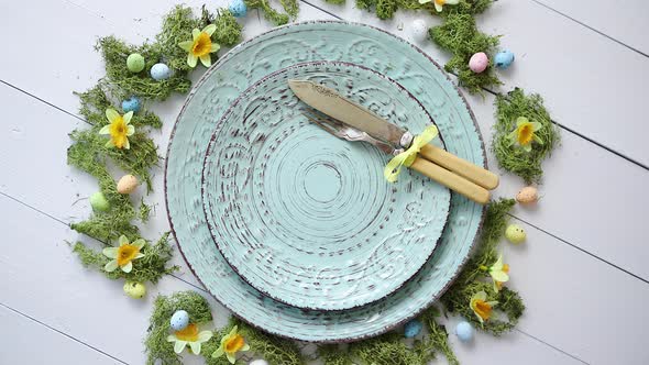 Easter Table Setting with Flowers and Eggs