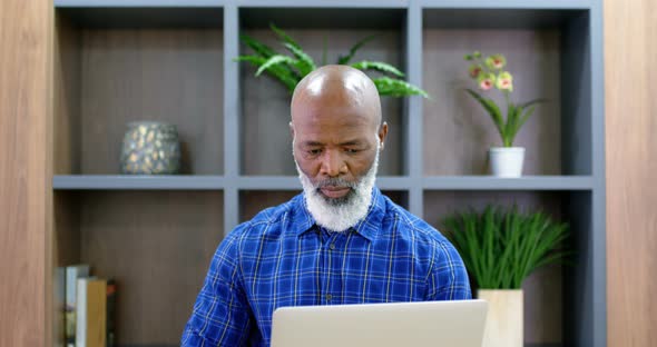 Senior Man Using Laptop in Conference Room 4k