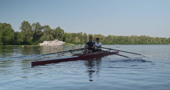 Young Sports Team Two Teenage Boys with Double Boat Kayak