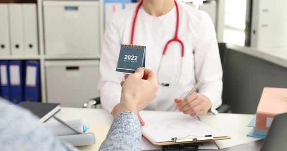 Patient Giving Doctor Applied Calendar for 2022 at Clinic  Movie