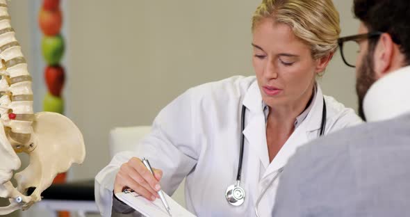 Physiotherapist interacting with patient