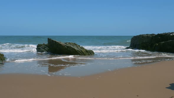 Blue Ocean Waves Crashing And Splashing On The Rocks In Brittas Bay Beach, County Wicklow, Ireland D