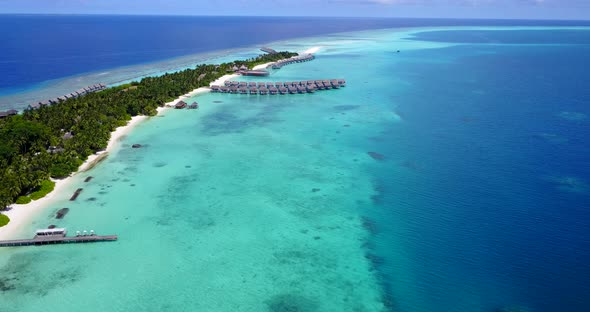 Natural birds eye island view of a sandy white paradise beach and turquoise sea background 