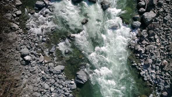 Drone Flying Down Colorful River alt