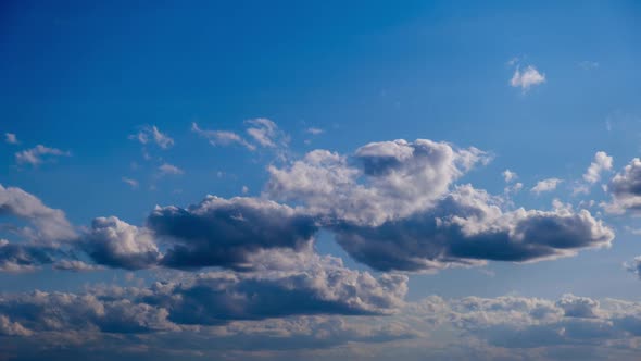 Timelapse of White Clouds Move and Dissolve in the Blue Sky Cloudy Space