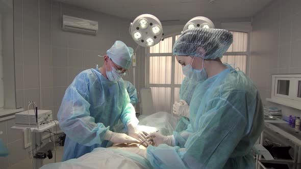 Nurse Assistant Scribbles the Area of the Incision During Surgery