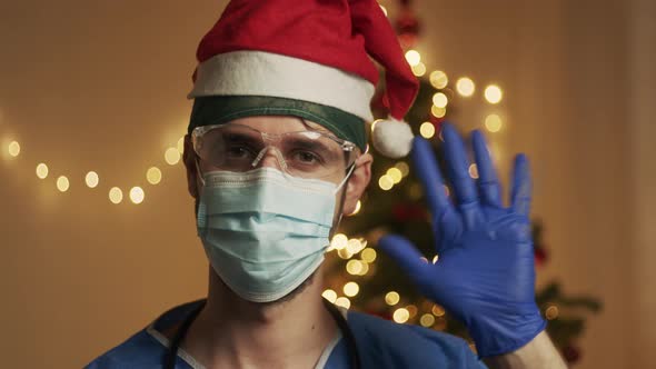 Doctor greets with Christmas tree