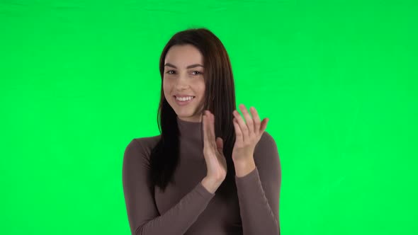 Attractive Girl Claps Her Hands with Wow Happy Joy and Delight. Green Screen