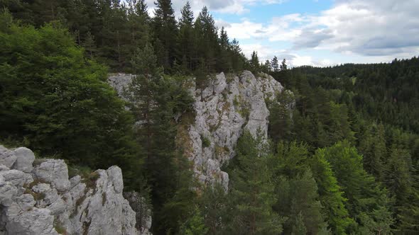 Aerial Cinematic Shot High Speed Sport Fpv Drone Flying Over Natural Mountain Cliff Surrounded