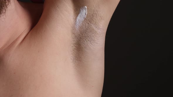 Deodorant Anti-Perspirant Cream Being Applied to Male's Armpit Area