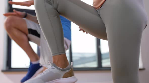 Happy Couple Exercising at Home