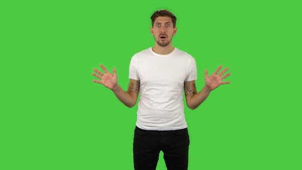 Confident Frustrated Guy Is Saying Wow with Shocked Facial Expression. Green Screen