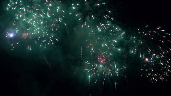 Colorful Firework display at night on sky background alt