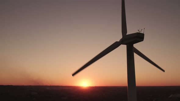 Wind turbine power plant for the production of clean ecological energy in front of the backdrop