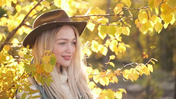 Adorable Caucasian Woman Is Posing Near Tree.