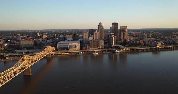 Louisville, Kentucky skyline with bridge with drone video moving sideways up high.