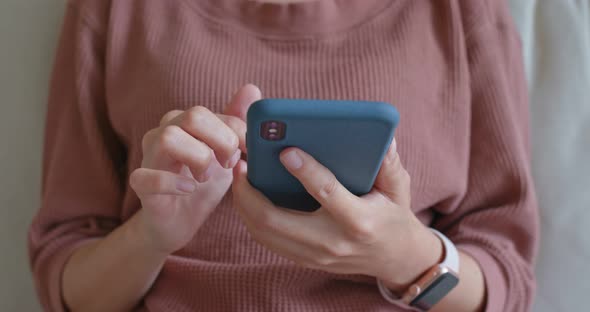 Woman use of cellphone at home