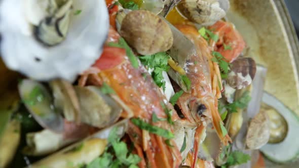 Cataplana with Fresh Seafood and Vegetables is Cooked on a Fire