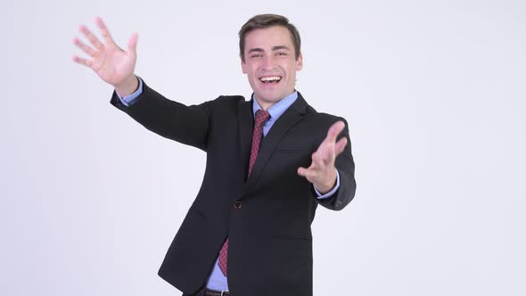 Young Happy Handsome Businessman with Surprise Gesture