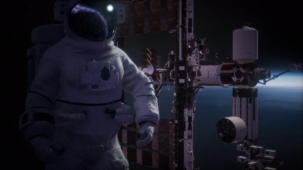 International Space Station and Astronaut in Outer Space Over the Planet Earth alt