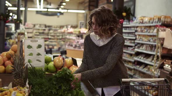 Young Woman Buying Ooganic Food in Supermarket