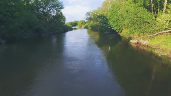 Girl in a Blue Kayak Floating. Aerial Video. Contact Filming, Copter Soars Up