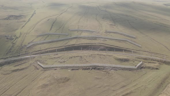 Samtskhe Javakheti, Georgia - August 28 2021: Aerial view of Snow protection fences near railroad.
