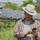 Asian farmers use smartphones to adjust solar cells degree and check solar cell performance - VideoHive Item for Sale