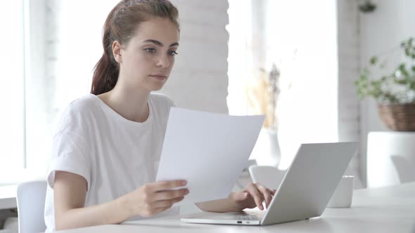 Pensive Young Woman Working in Office, Paperwork