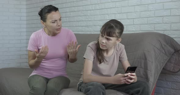 Teen with Phone By Mother