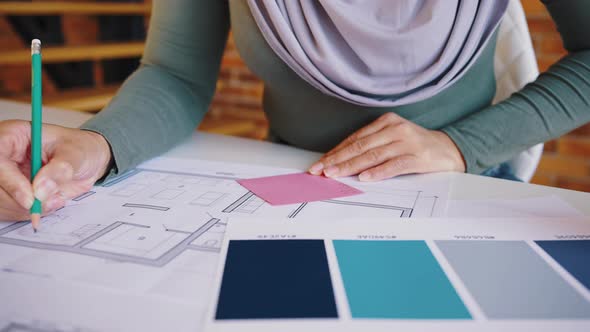 Closeup of an Interior Designer Womans Hand