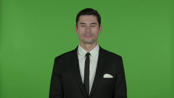 Young Businessman Waving at Camera, Chroma Key