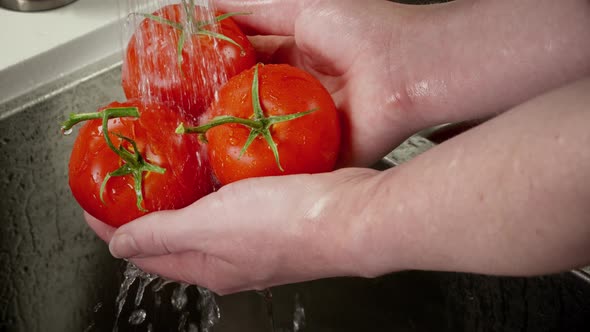 Close Up Of Tomatoes Being Washed