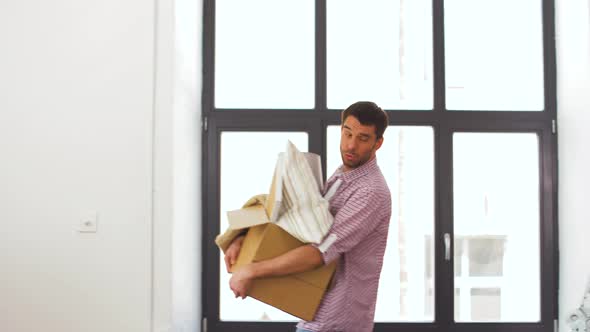 Happy Couple with Stuff Moving To New Home