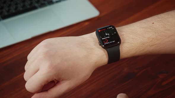 Man Student Using Smartwatch Closeup