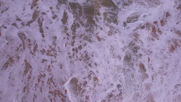 Beautiful texture of big waves power ocean waves with white waves break on beach sand at Phuket