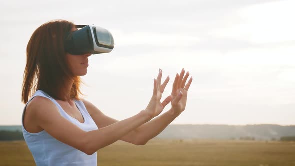 Woman with Glasses of Virtual Reality at Nature