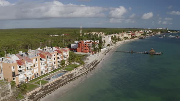Aerial drone view of beautiful beach resort with hotel on the shores of the beautiful seaside