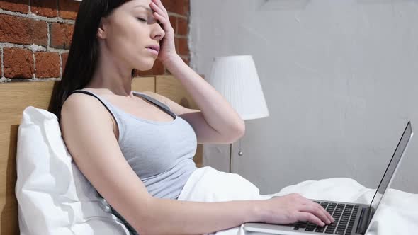 Headache Woman Working on Laptop in Bed Blood Pressure