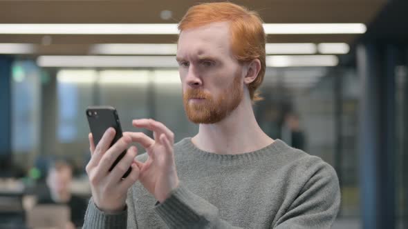 Portrait of Young Man Using Smartphone