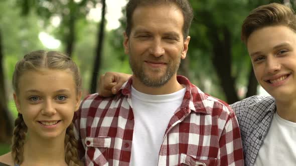 Healthy Son Daughter Father Smiling and Showing Thumbs Up After Dentist Visit