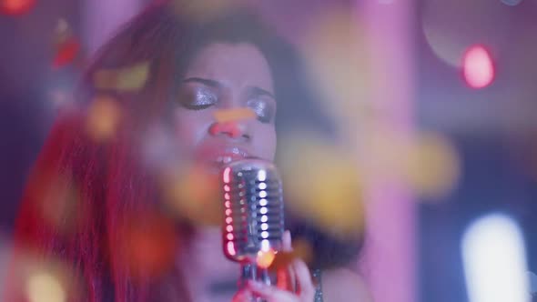 Luxury Party Portrait of a Young African Female Singing in a Nightclub Closeup of a Woman's Face in