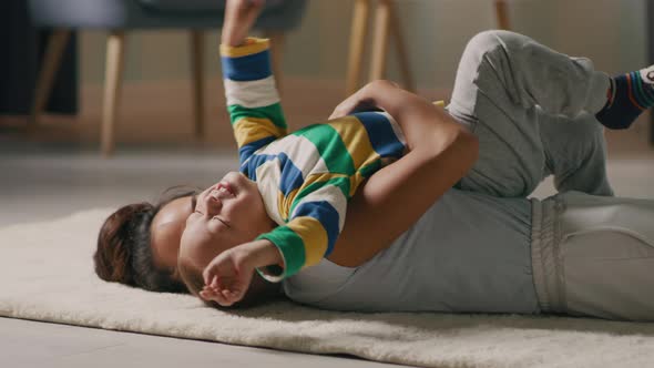 Mother Playing with Son on Floor