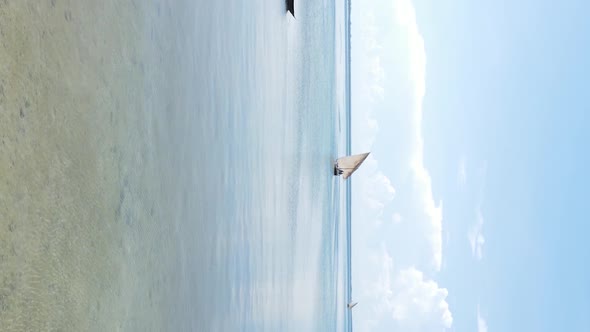 Tanzania Vertical Video  Boat Boats in the Ocean Near the Coast of Zanzibar Aerial View