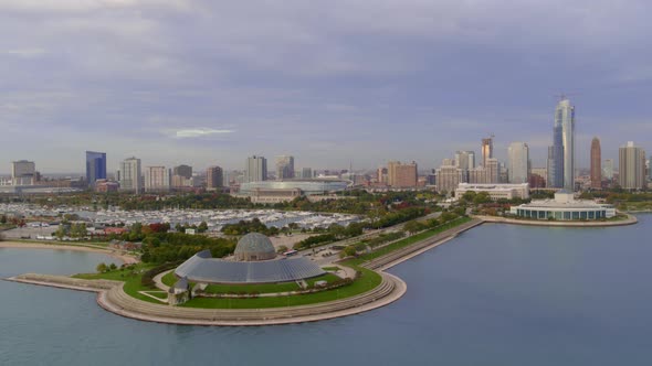 Aerial of Adler planetarium and Chicago city in background