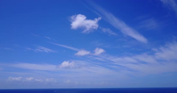 Luxury overhead clean view of a paradise sunny white sand beach and aqua blue water background in hi