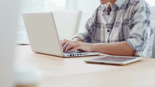 Businesswoman working on laptop